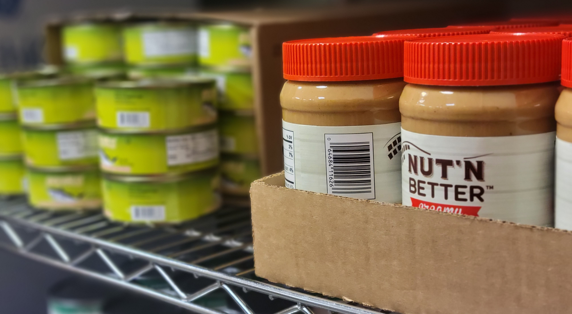 peanut butter jars on food pantry shelf